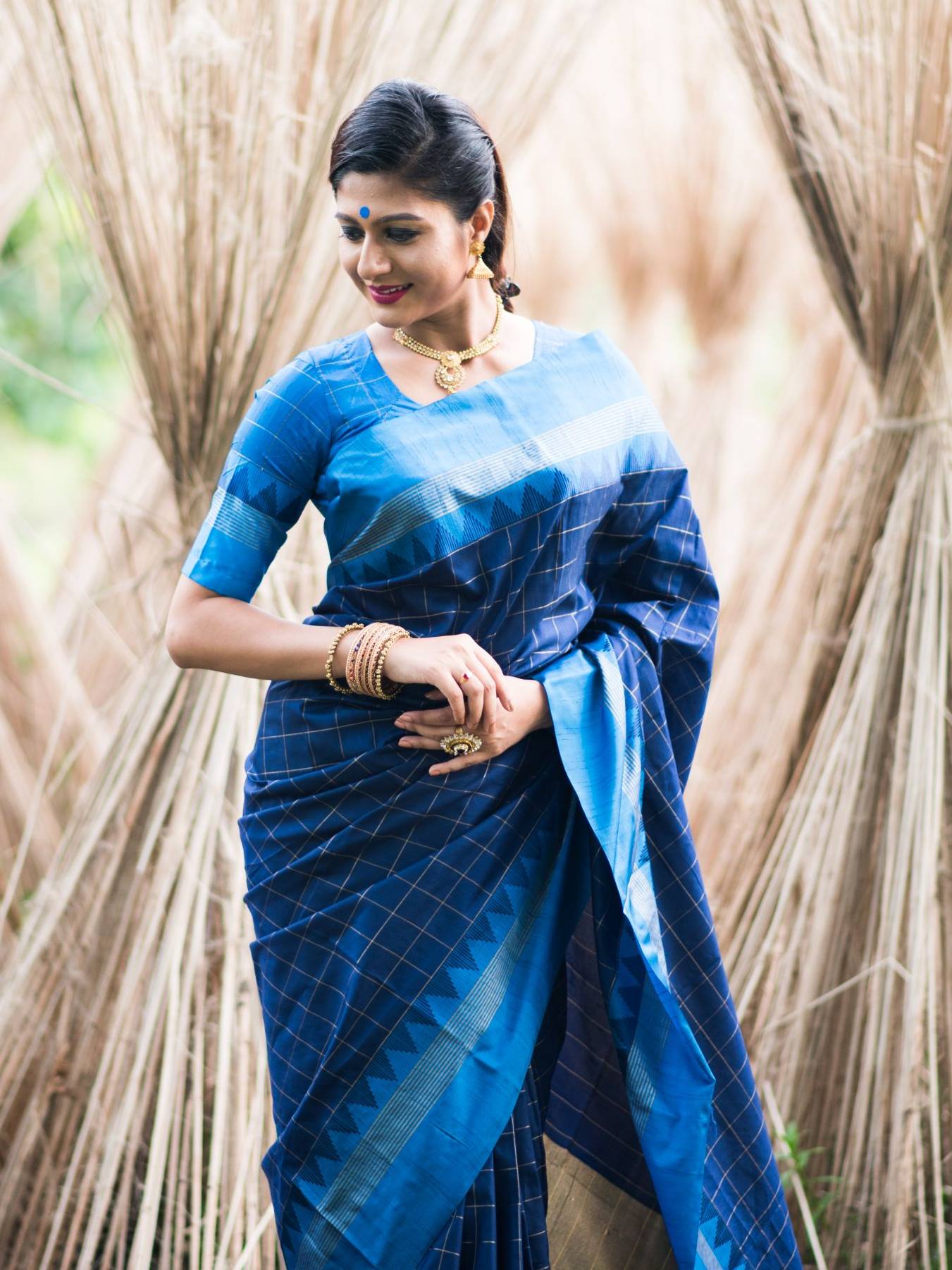 Soft Raw Silk saree with Contrast Temple Woven Border and all over Checks Weaves with Zari Pallu and Tassels