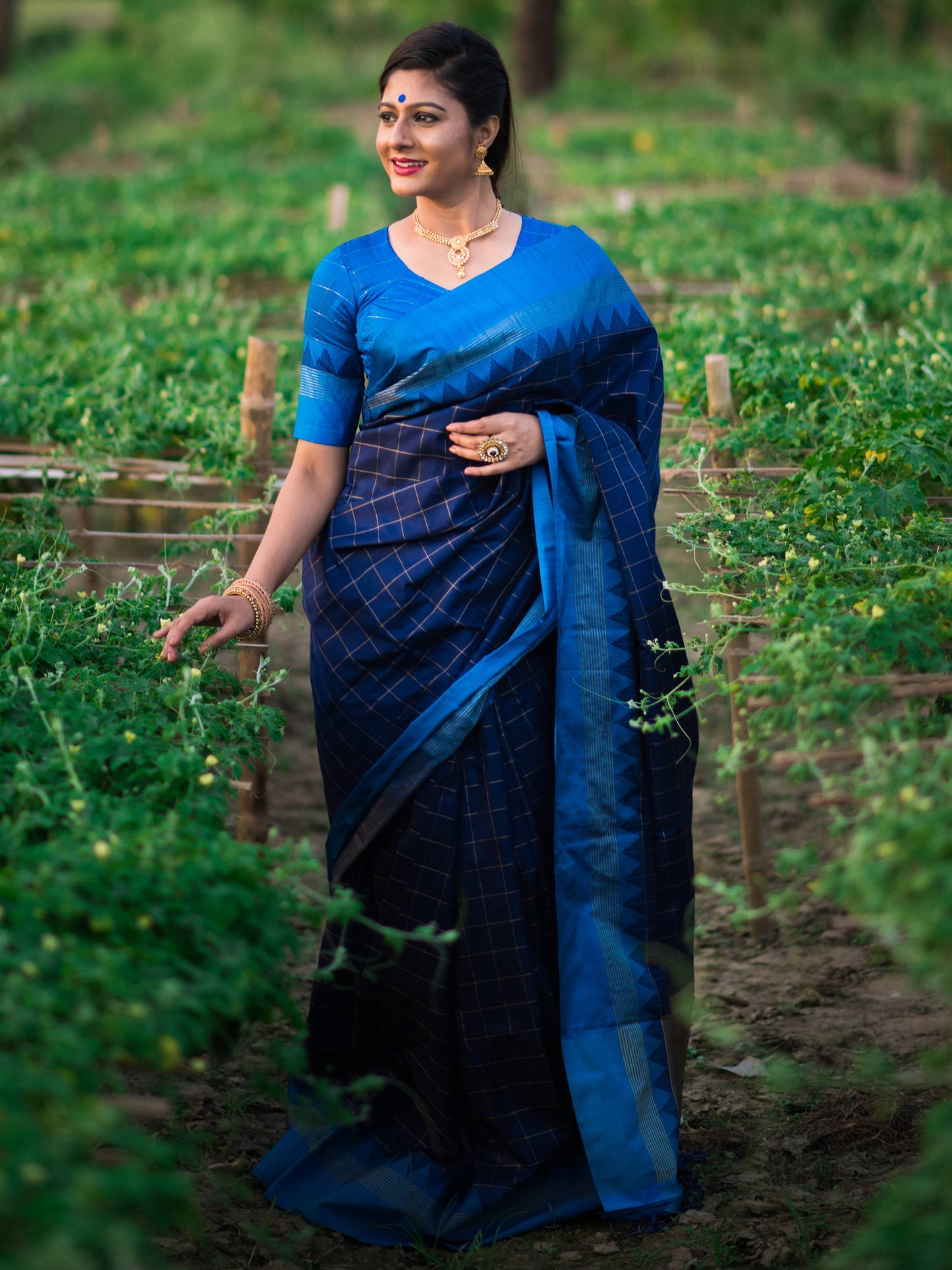 Soft Raw Silk saree with Contrast Temple Woven Border and all over Checks Weaves with Zari Pallu and Tassels