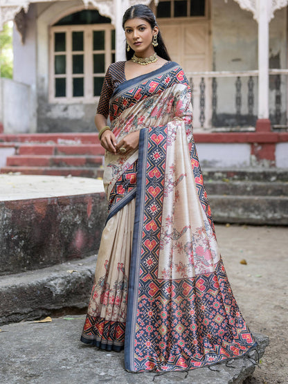 Soft Tussar Silk with Patola Print on Pallu with Floral Jal  on body.