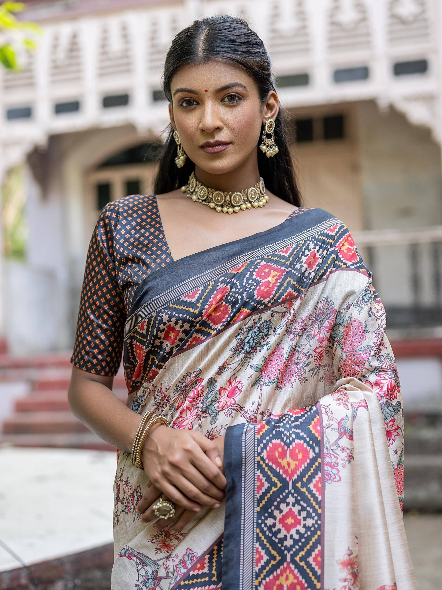 Soft Tussar Silk with Patola Print on Pallu with Floral Jal  on body.