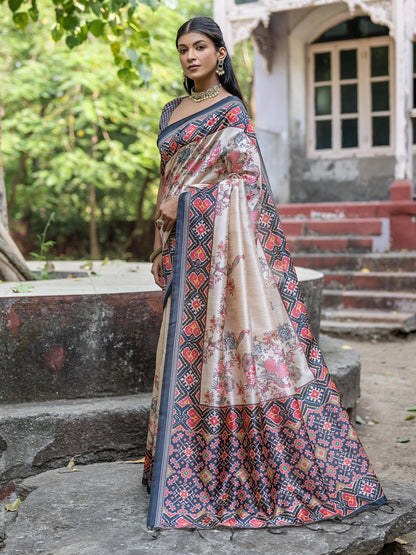 Soft Tussar Silk with Patola Print on Pallu with Floral Jal  on body.