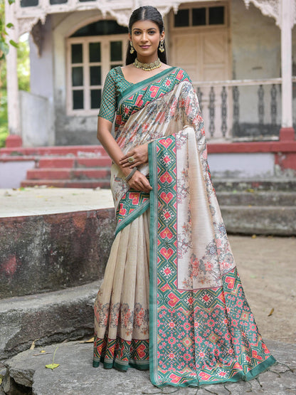 Soft Tussar Silk with Patola Print on Pallu with Floral Jal  on body.