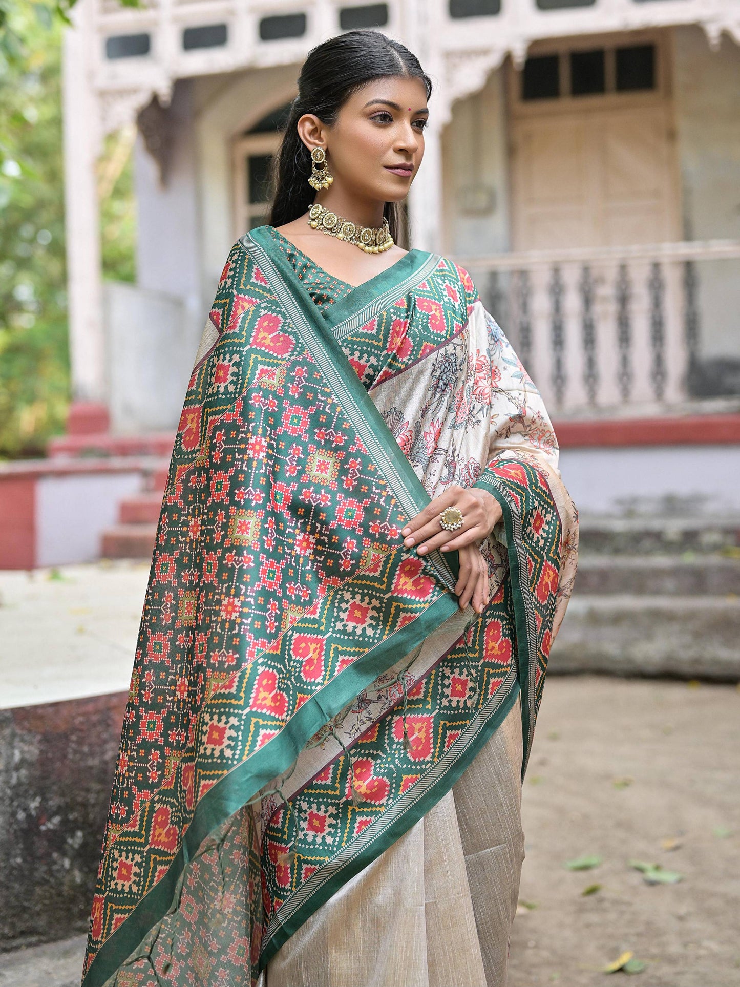 Soft Tussar Silk with Patola Print on Pallu with Floral Jal  on body.