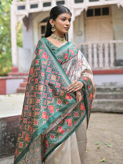 Soft Tussar Silk with Patola Print on Pallu with Floral Jal  on body.